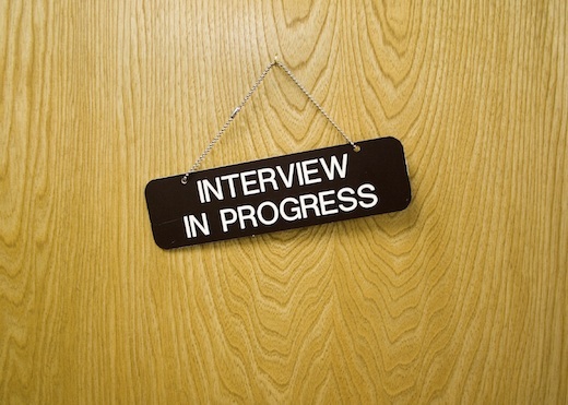 interview sign on a wooden door